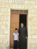 Front of Church with Abouna and the icon of St. George